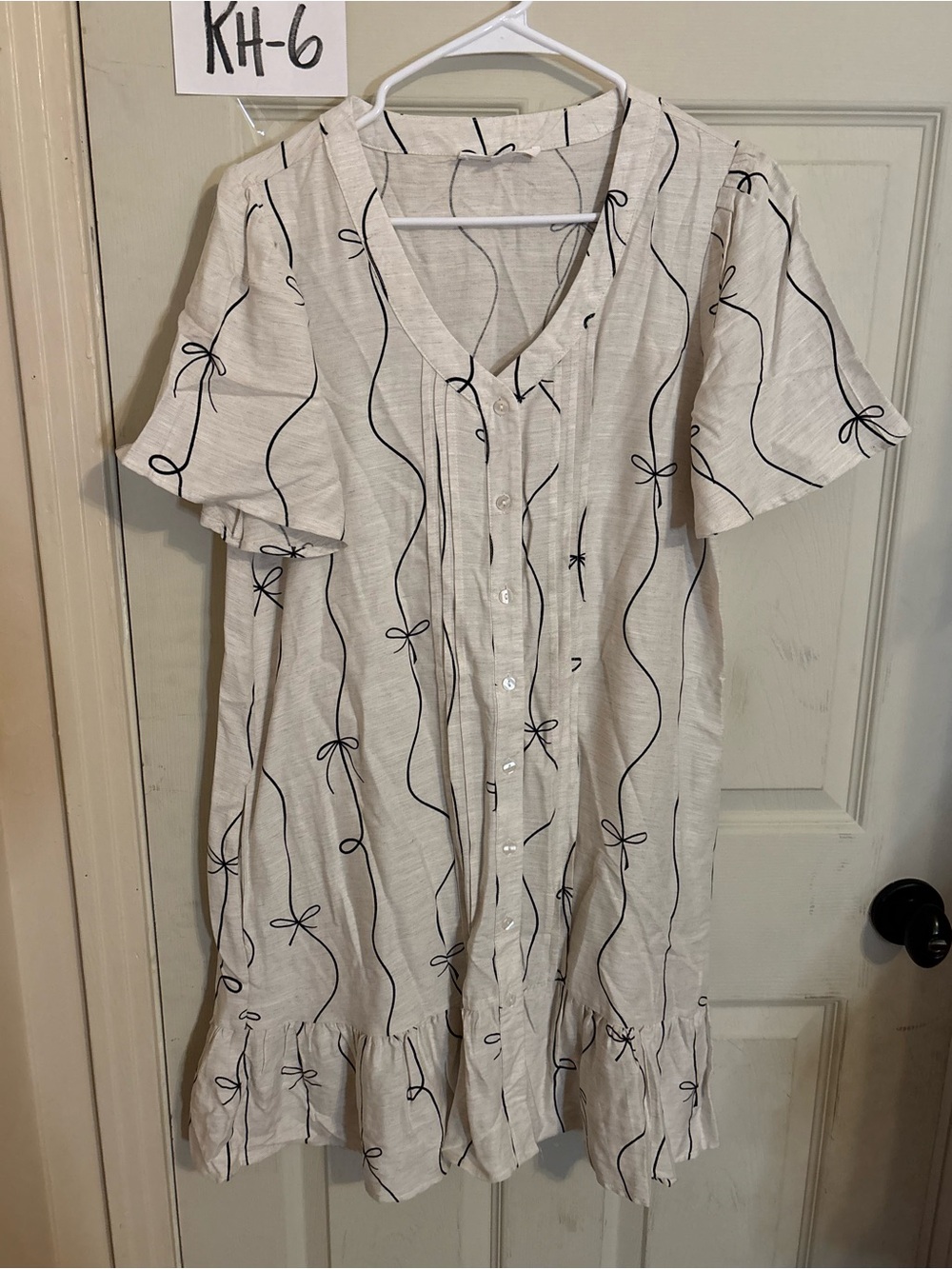 Jane and Delancey Ivory Dress with Black Line and Bow Motif